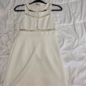 White sleeveless dress.